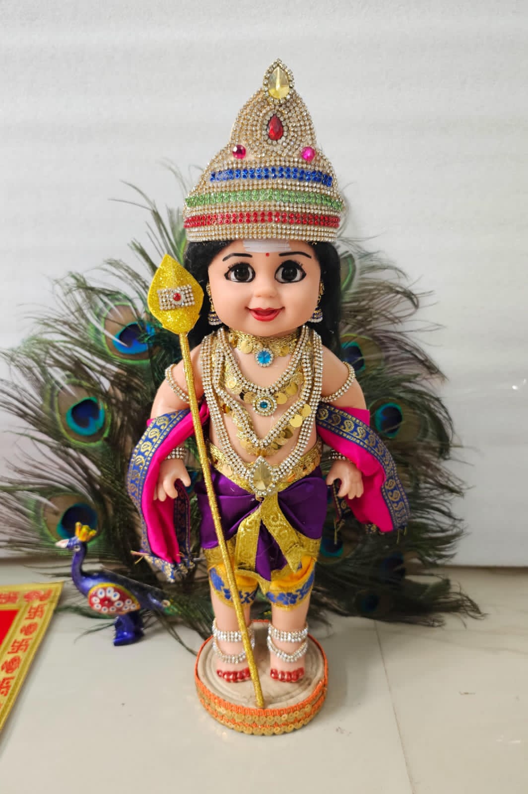 Hand decorated Raja Murugar Doll with Peacock